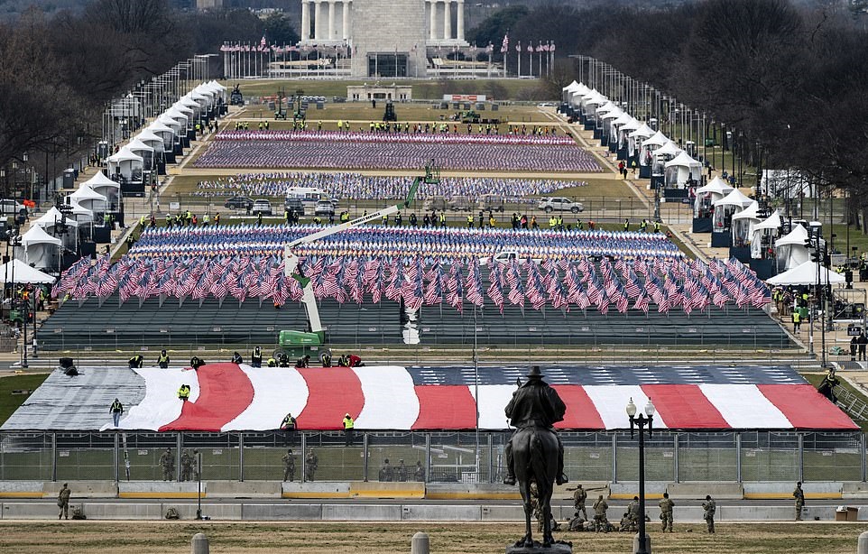 38185806 9162205 A sea of flags is on display down the National Mall ahead of the a 121 1611041960977